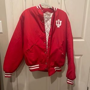 a red and white Indians coat with strips on the bottom of the coat and sleeves